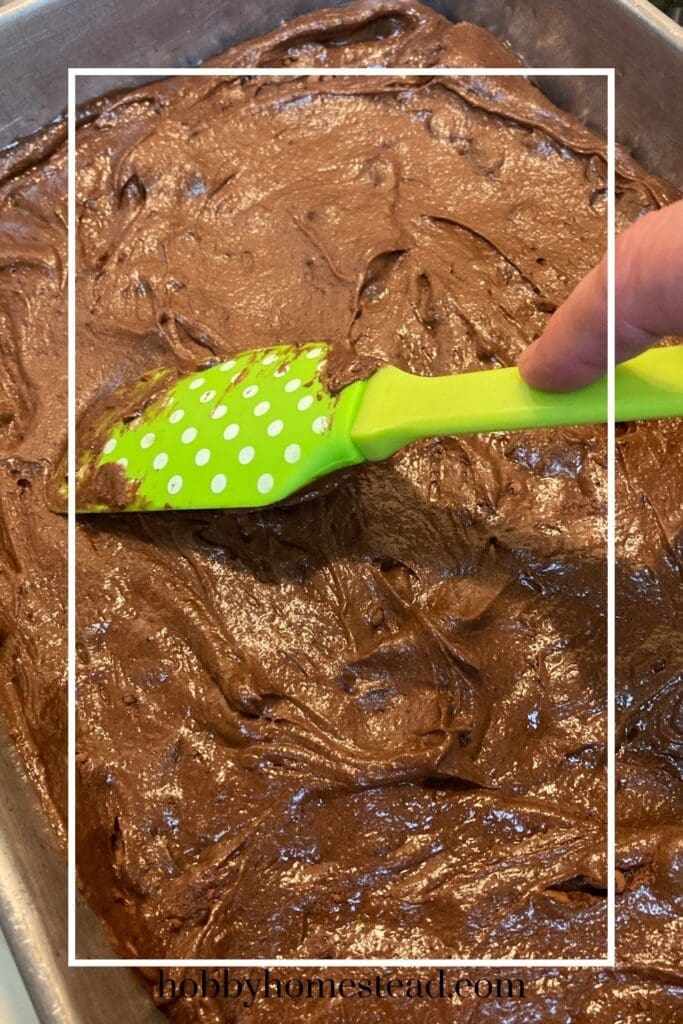 Spreading the brownie batter in the pan