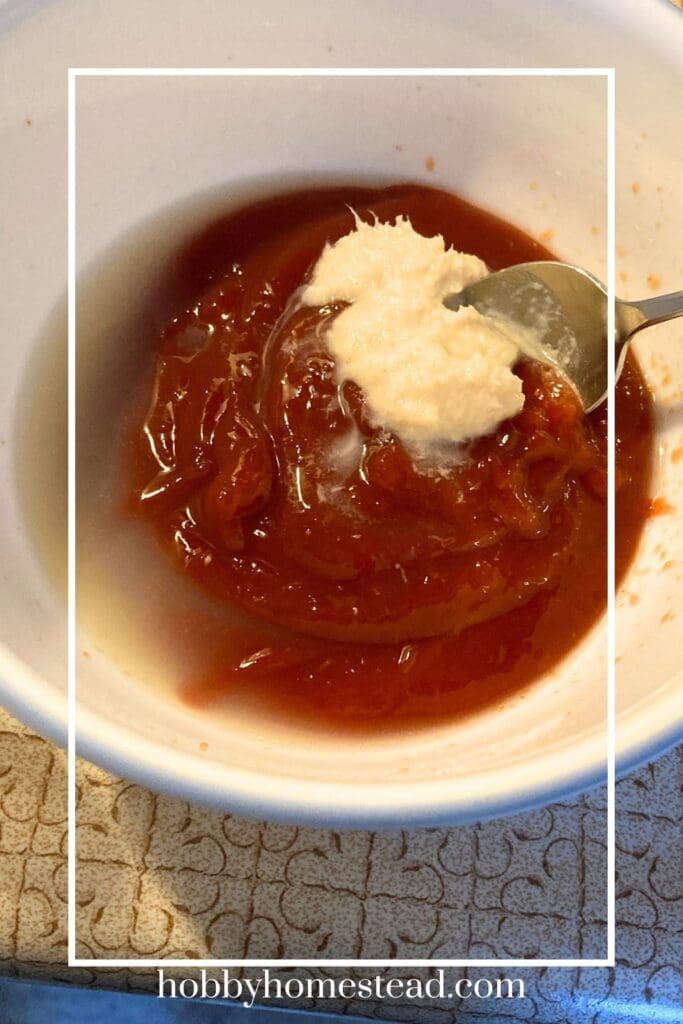 Adding 3 ingredients to a bowl for cocktail sauce