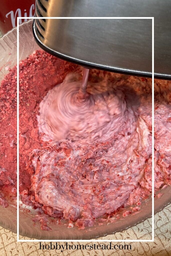 mixing in the freeze-dried strawberries