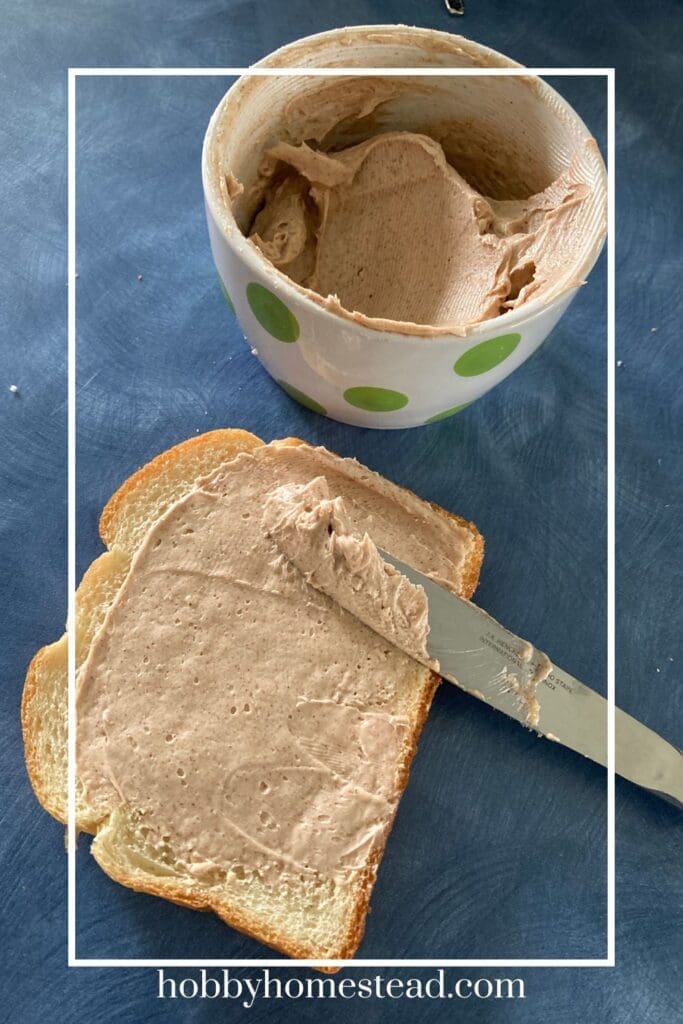 spreading honey cinnamon butter on bread