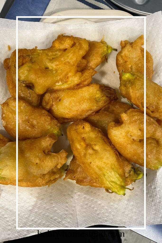 Plate full of squash blossoms fried in batter