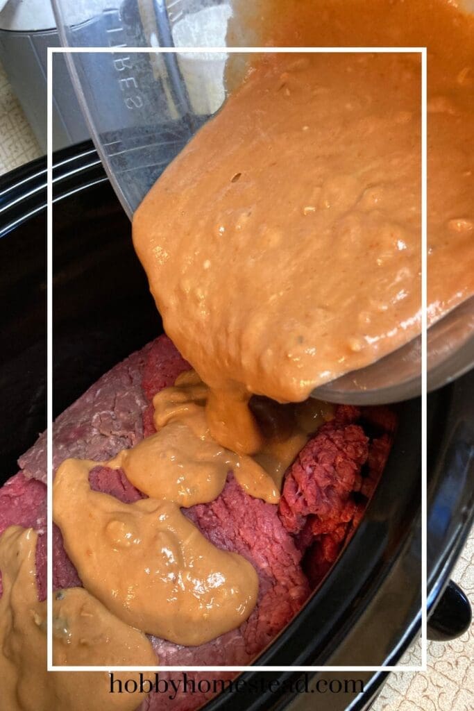 Pouring the Gravy Mixture Over the Cube Steak