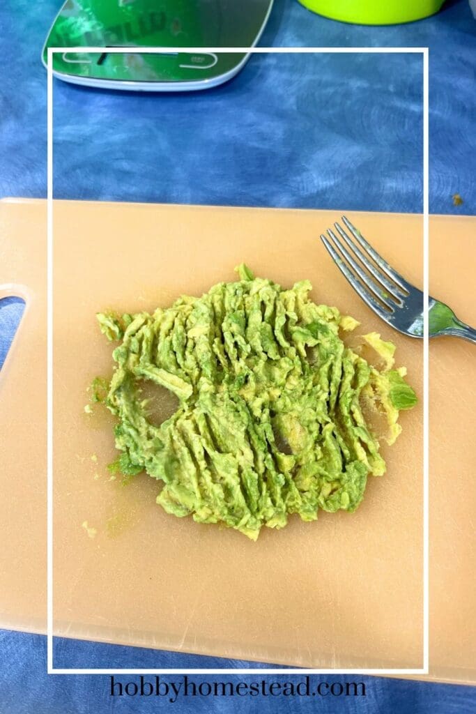 mashing the avocado