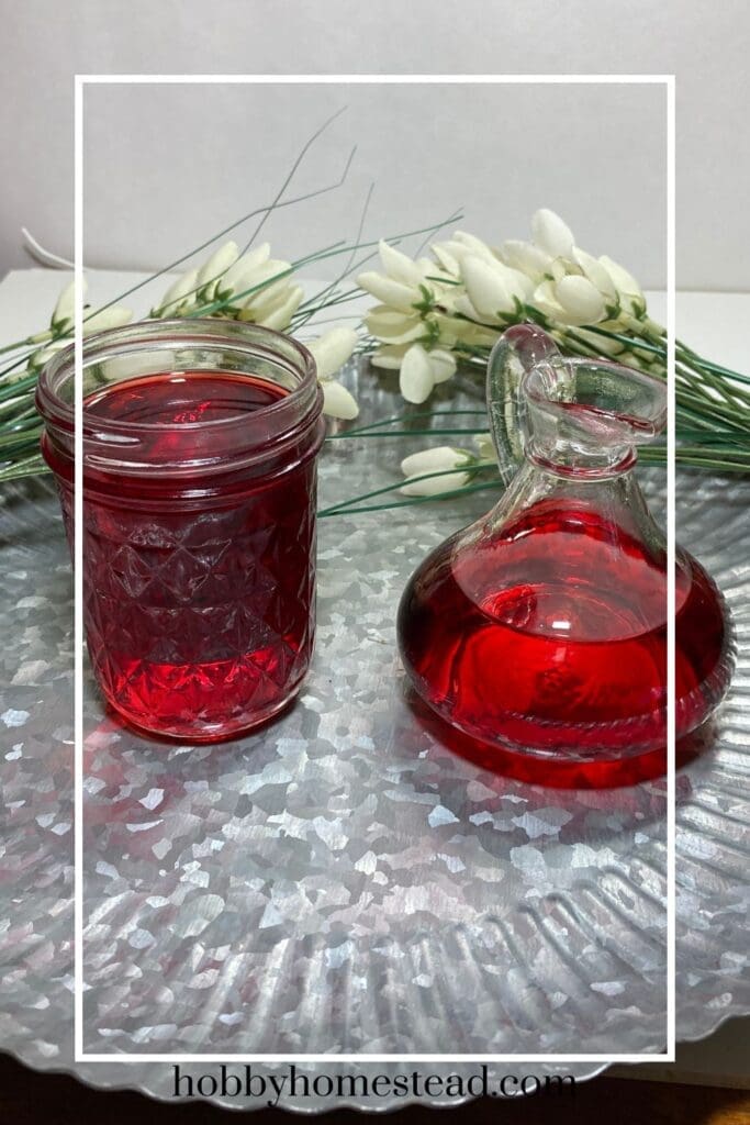 Two containers of fresh strawberry simple syrup