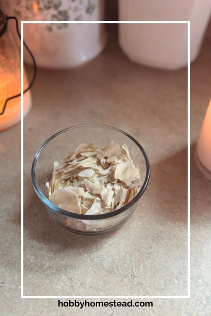 Cup of sourdough starter flakes