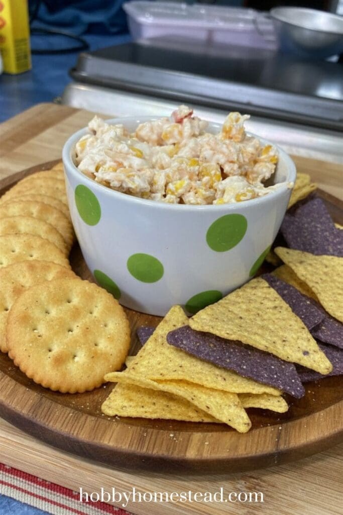 corn dip on platter with crackers and chips